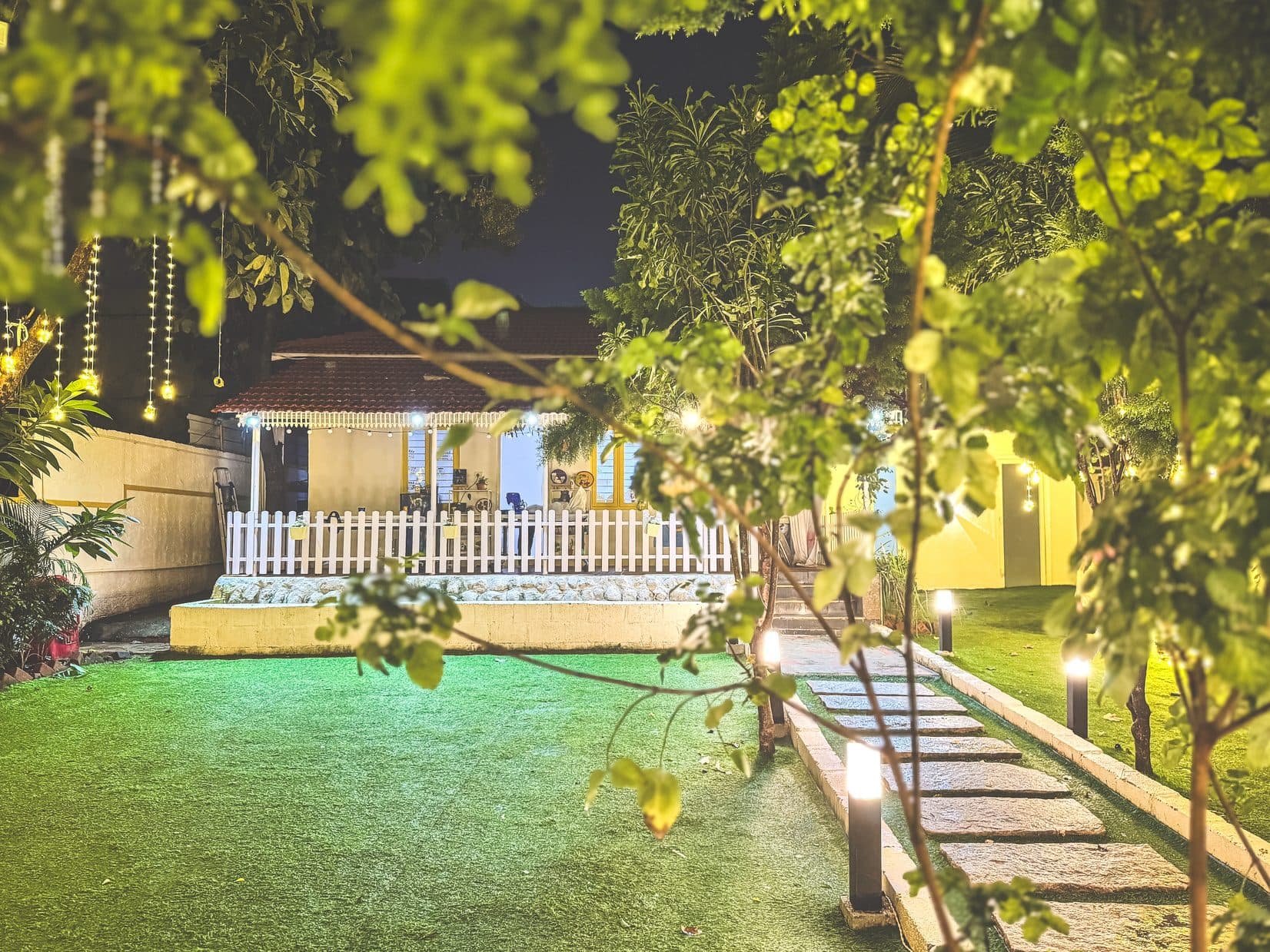 The main house lit up at night