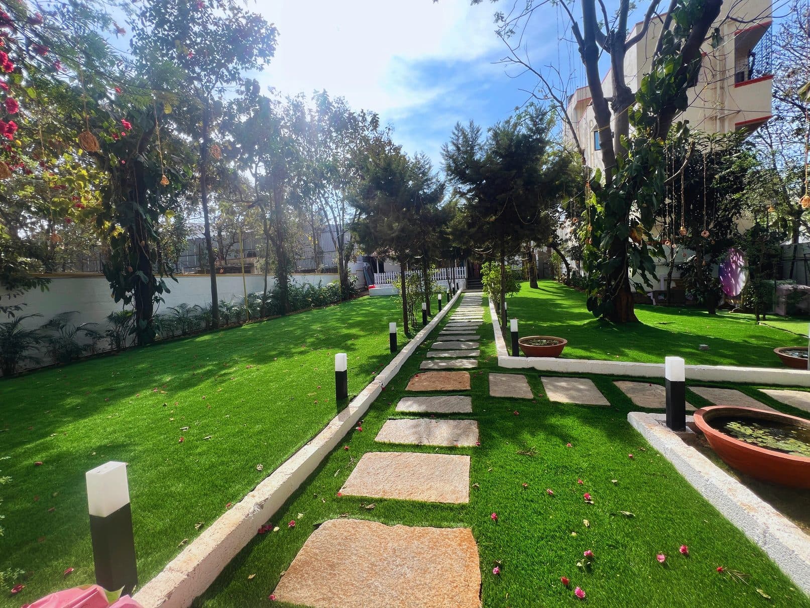 Stone pathway through the garden by day